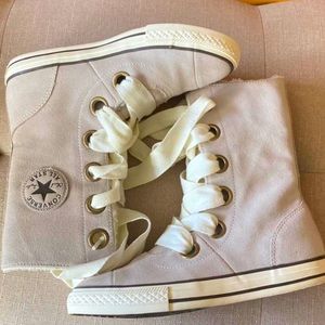 calf high converse boots.